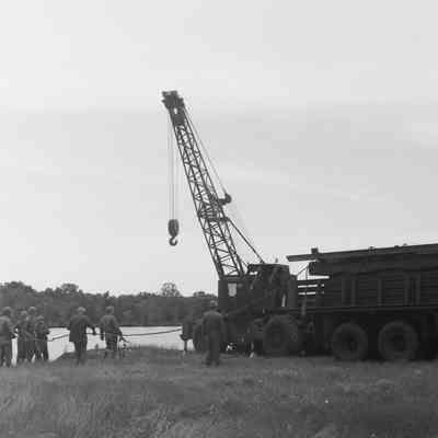 Soldiers training to construct a pontoon bridge