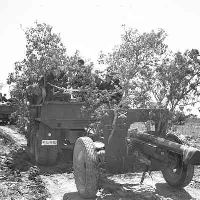 Truck pulling artillery piece