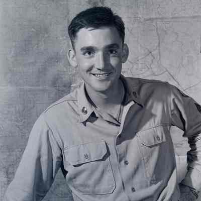 Portrait of a soldier in front of a wall map