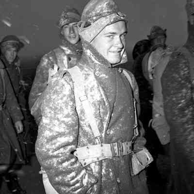 Soldiers marching in bad weather