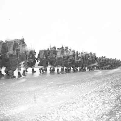Soldiers marching in bad weather