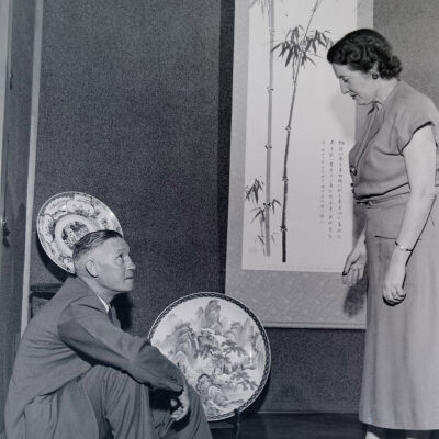 Civilian couple examining Japanese art