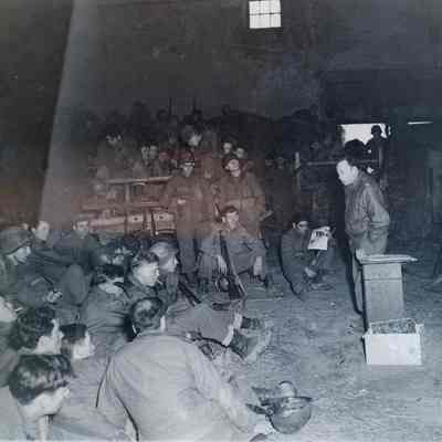 Soldiers listening to a lecture on propaganda
