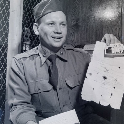 Soldier displaying letter from home