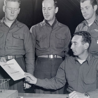 Soldier receiving an honorable discharge certificate