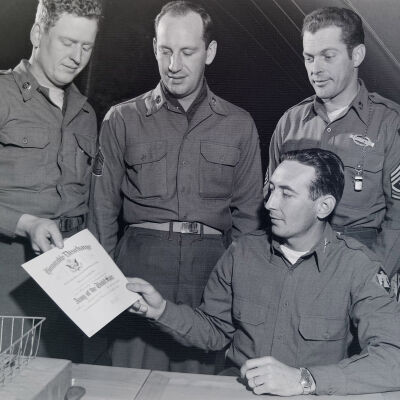 Soldier receiving an honorable discharge certificate