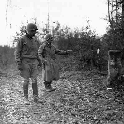 Soldier pointing at border marker