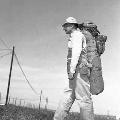 Soldier demonstrating how to carry military clothing
