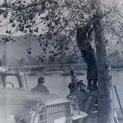 Soldiers crossing river