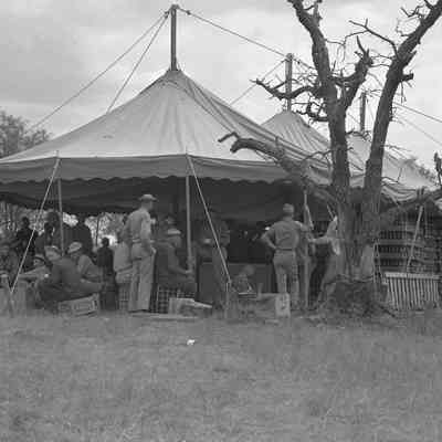 Soldiers gathered around a mess tent