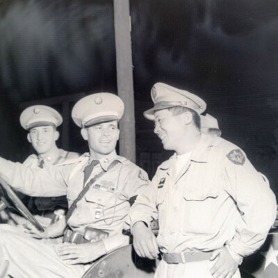 Soldies chatting with a member of the Japanese National Police Reserve