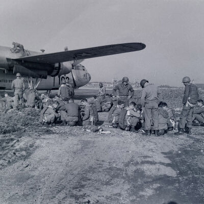 Paratroopers preparing to board a C-119 aircraft