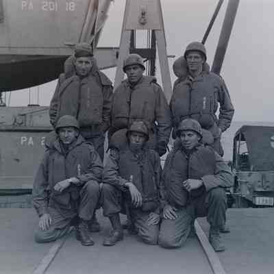 Group photo of soldiers onboard a ship