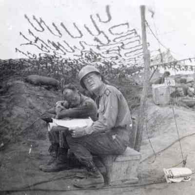 Soldiers looking over a Map