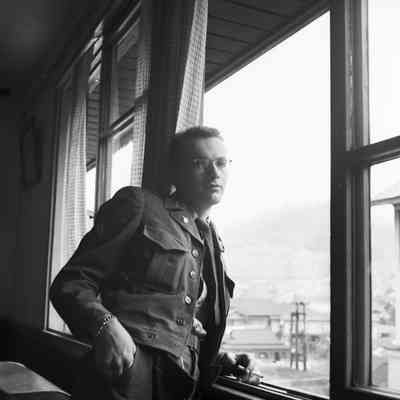 Soldier relaxing at window at Noboroibetsu Hotel