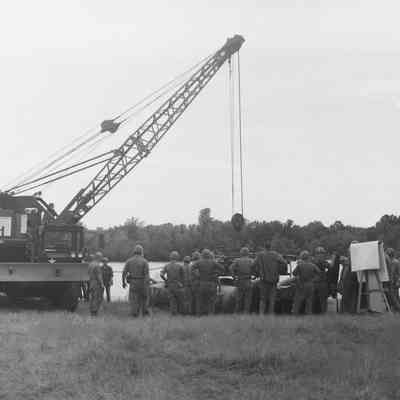 Soldiers training to construct a pontoon bridge