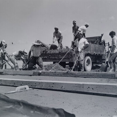 Japanese civilians pour concrete