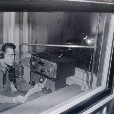 Soldier inside a broadcasting booth