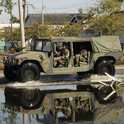 Humvee driving through flood water