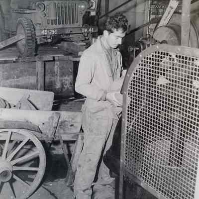 Soldier in vehicle maintenance shop