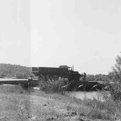 Truck parked on pontoon bridge section