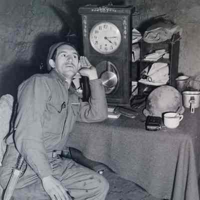 Soldier listening to clock
