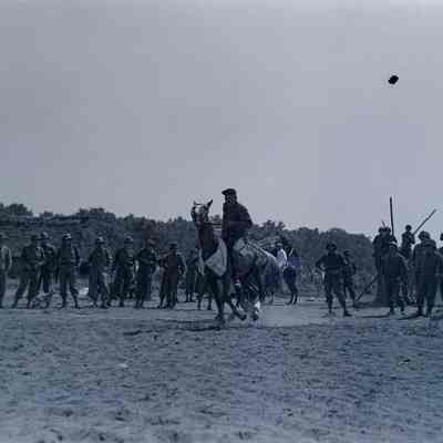 Soldiers racing horses