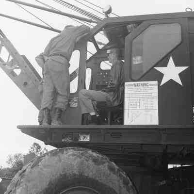 Soldiers training to construct a pontoon bridge