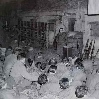 Soldiers listening to lecture on American propaganda