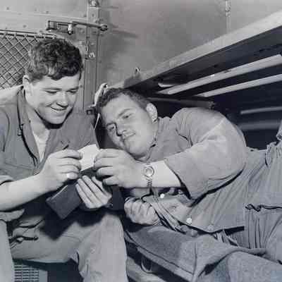 Two soldiers looking at the ambulance driver shuttle system
