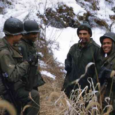 Soldiers talking in a snowy field