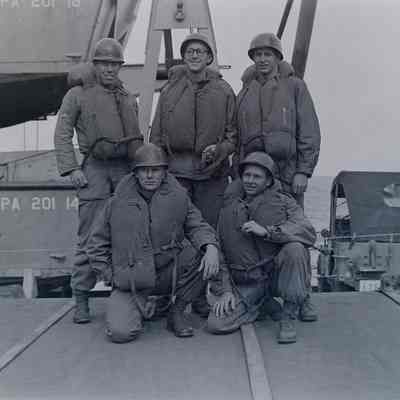 Group photo of soldiers onboard a ship