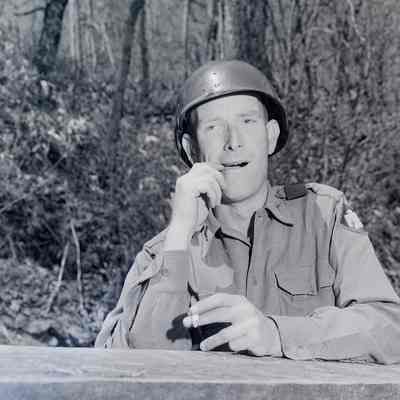 Soldier picking his teeth