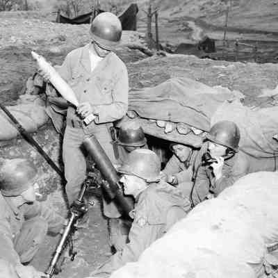 Soldiers preparing to fire a mortar