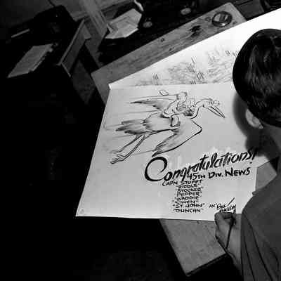 Bill Mauldin at his drawing board