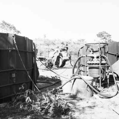 Soldiers operating field water purification plant