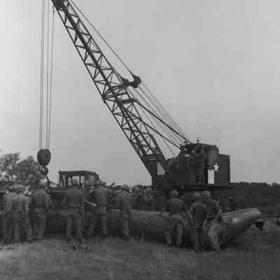 Soldiers training to construct a pontoon bridge
