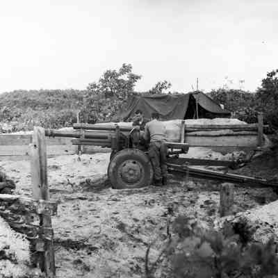 Soldiers working on artillery piece