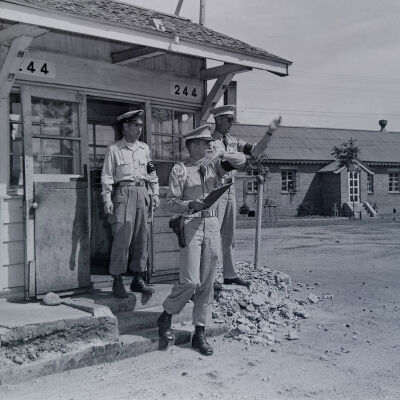 Military Police at camp gate directing traffic