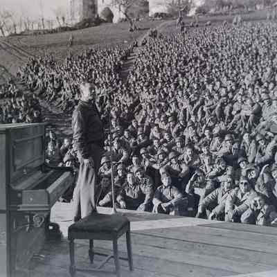 Soldiers watching entertainer Joe E. Brown