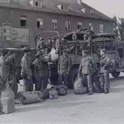 Soldiers boarding transport truck