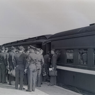 Group of soldiers boarding a train