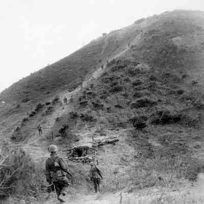 Soldiers marching up hill
