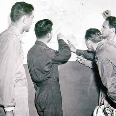 Pilots looking at chart