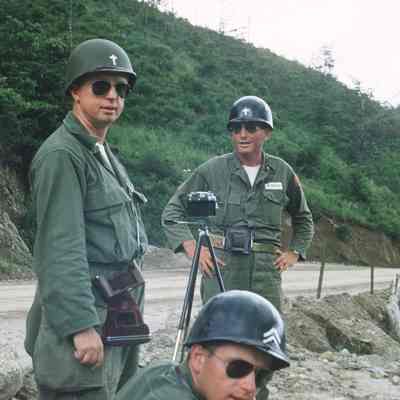 Chaplains setting up a camera on the side of the road
