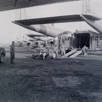 Jeeps unloading from a C-119 cargo aircraft