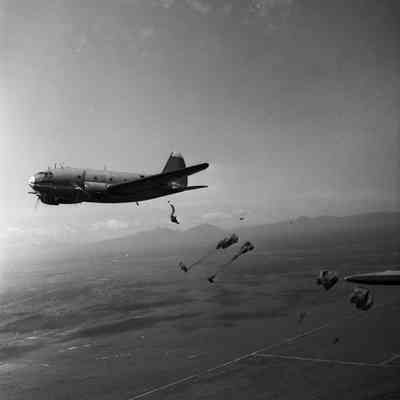 Paratroopers jumping from a C-46