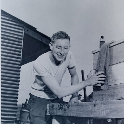 Soldier using outdoor camp wash basin