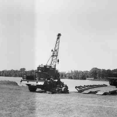 Soldiers training to construct a pontoon bridge
