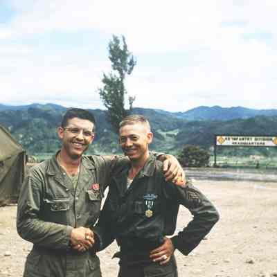 Soldiers showing off their medals